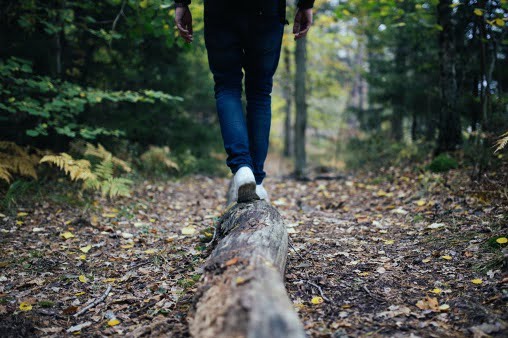 A teen walking in nature to copy with stress.